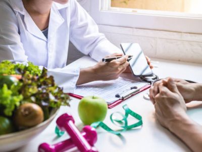 Nutritionist giving consultation to patient with healthy fruit and vegetable, Right nutrition and diet concept